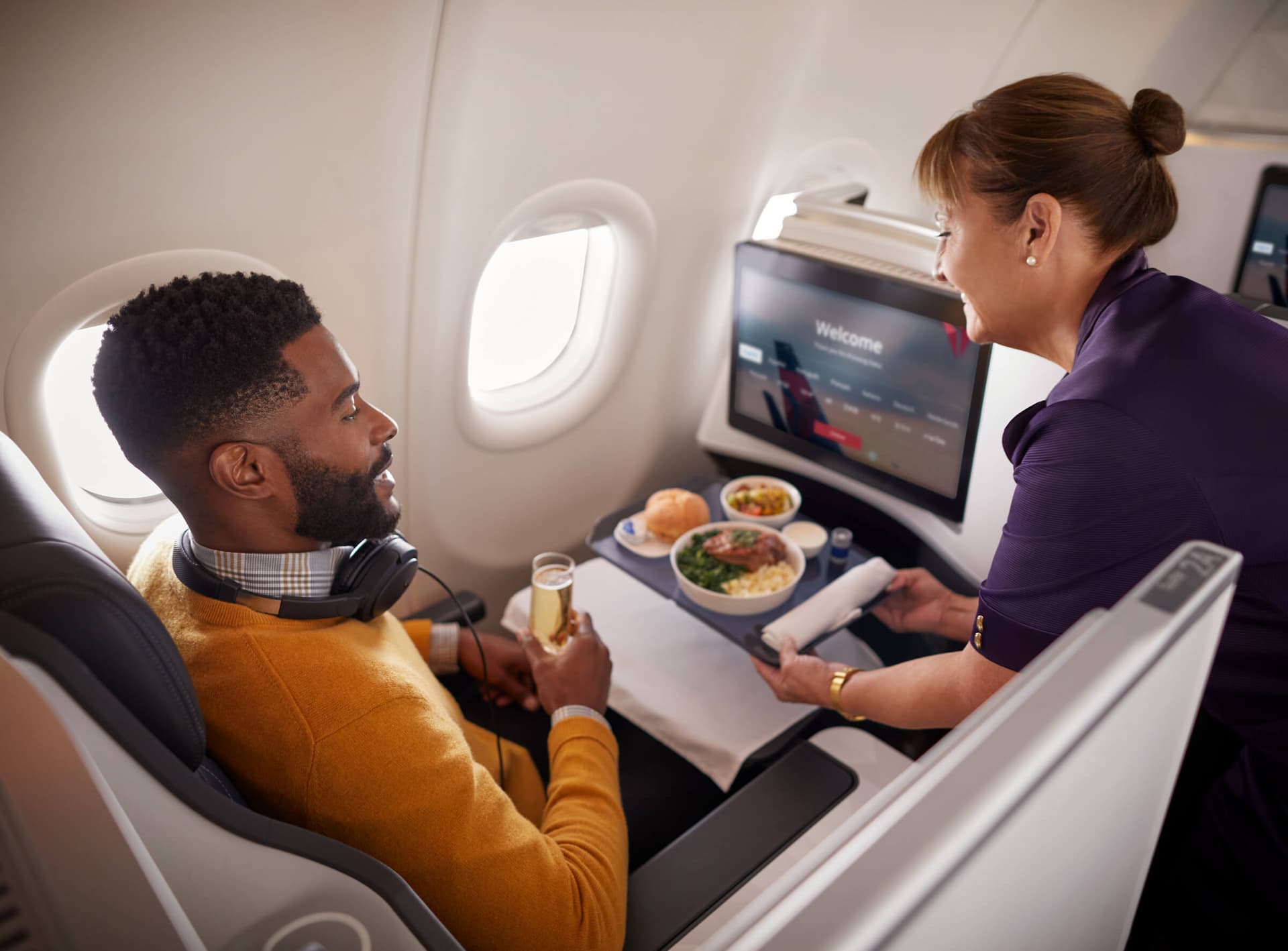 A business professional working in an airport lounge, symbolizing the card's premium access.
