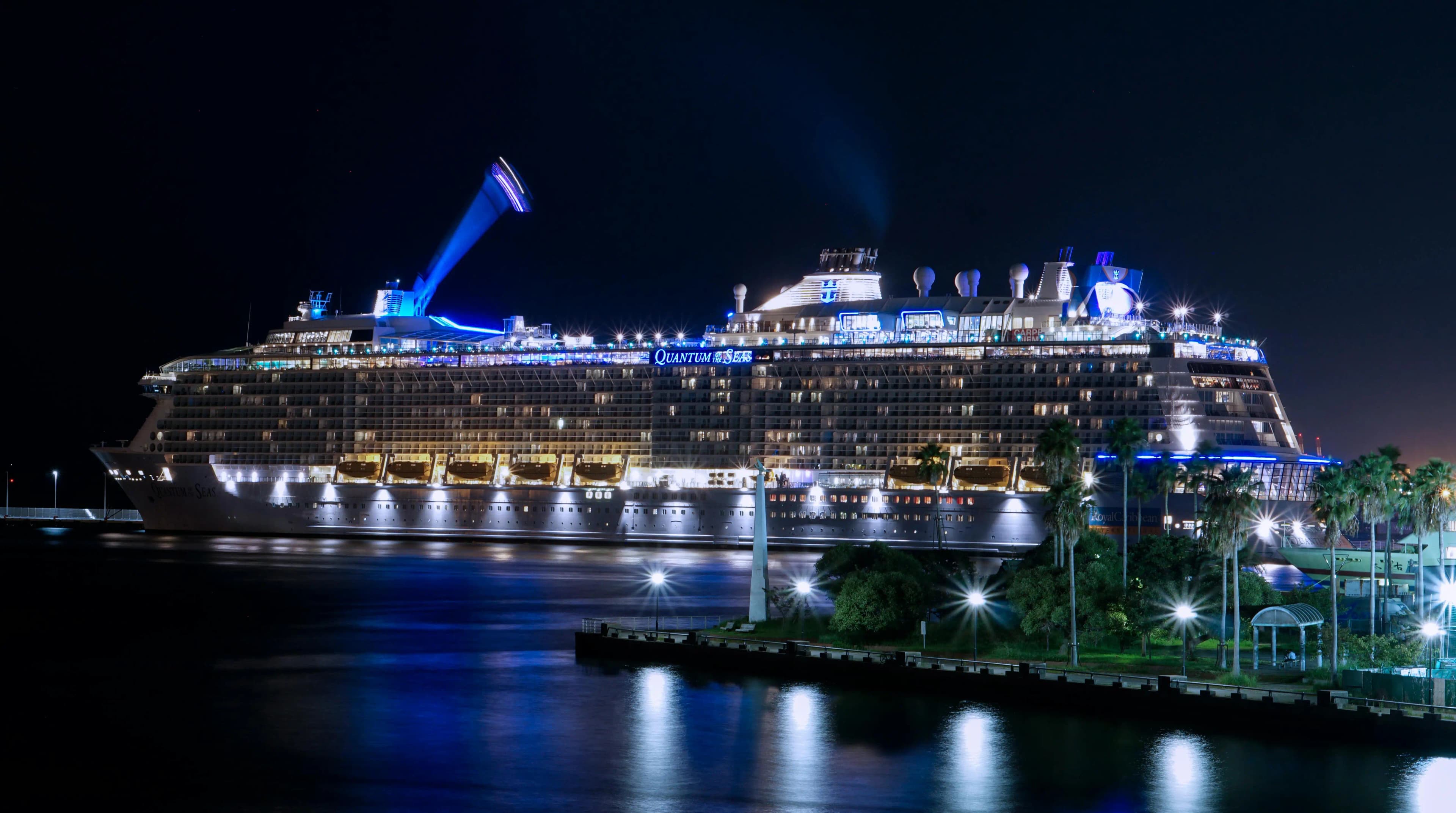 View from a cruise ship deck at sunset, overlooking the ocean, symbolizing a rewarding cruise vacation.